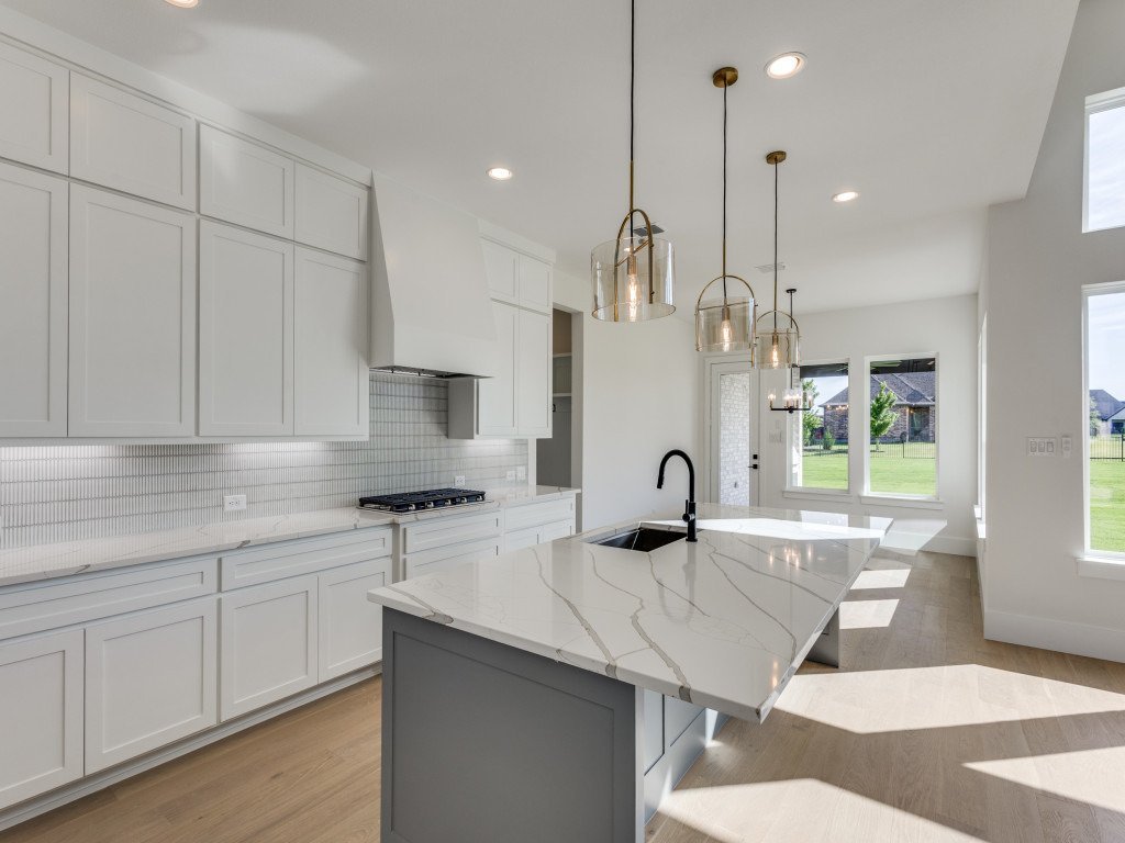 Custom kitchen overlooking the open living area and backyard