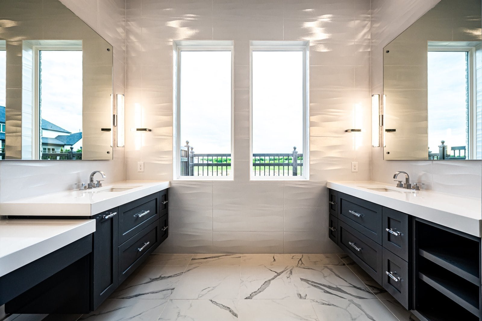 Primary bathroom with dual vanities at Chambord Custom Home II