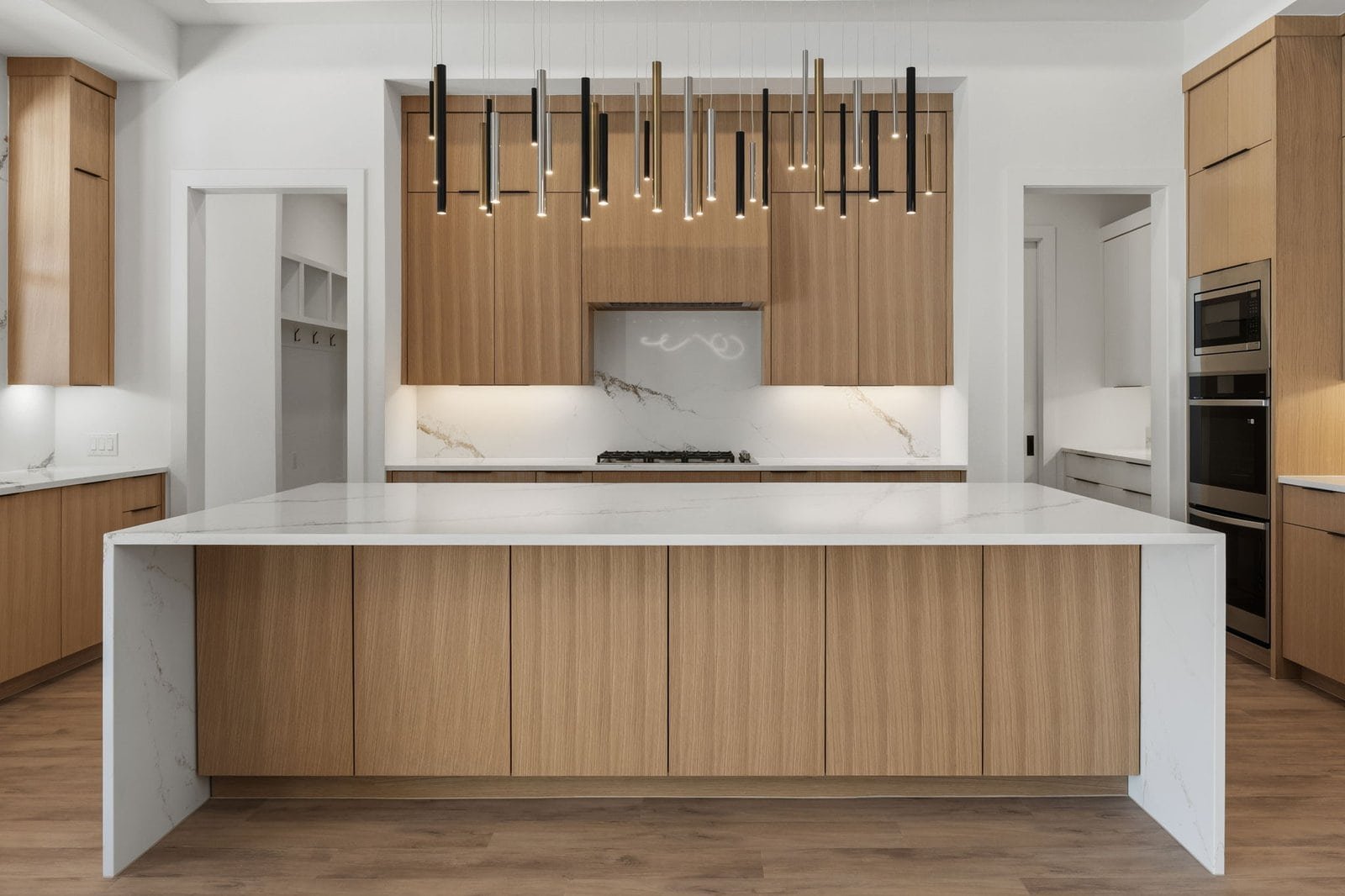 Custom kitchen with a large island and wood cabinetry in a Melissa home