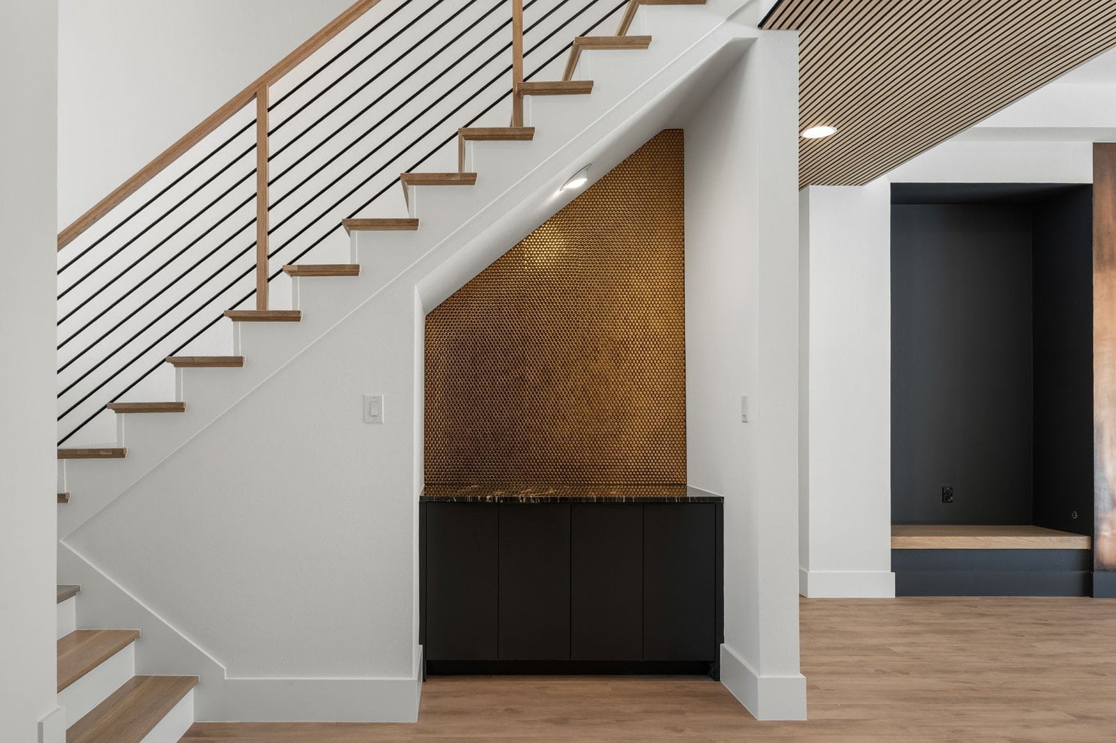 Modern staircase with a custom built-in niche in a Melissa residence