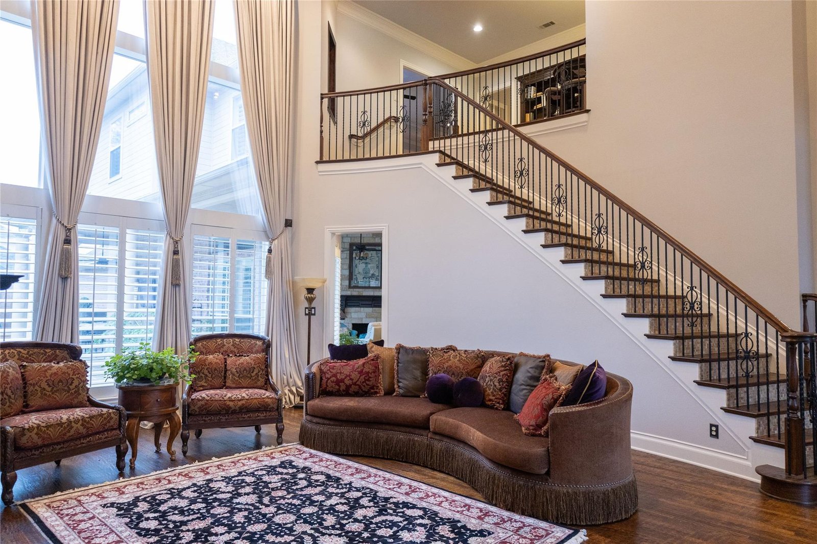 Before the Plano whole-home remodel: original living area and staircase